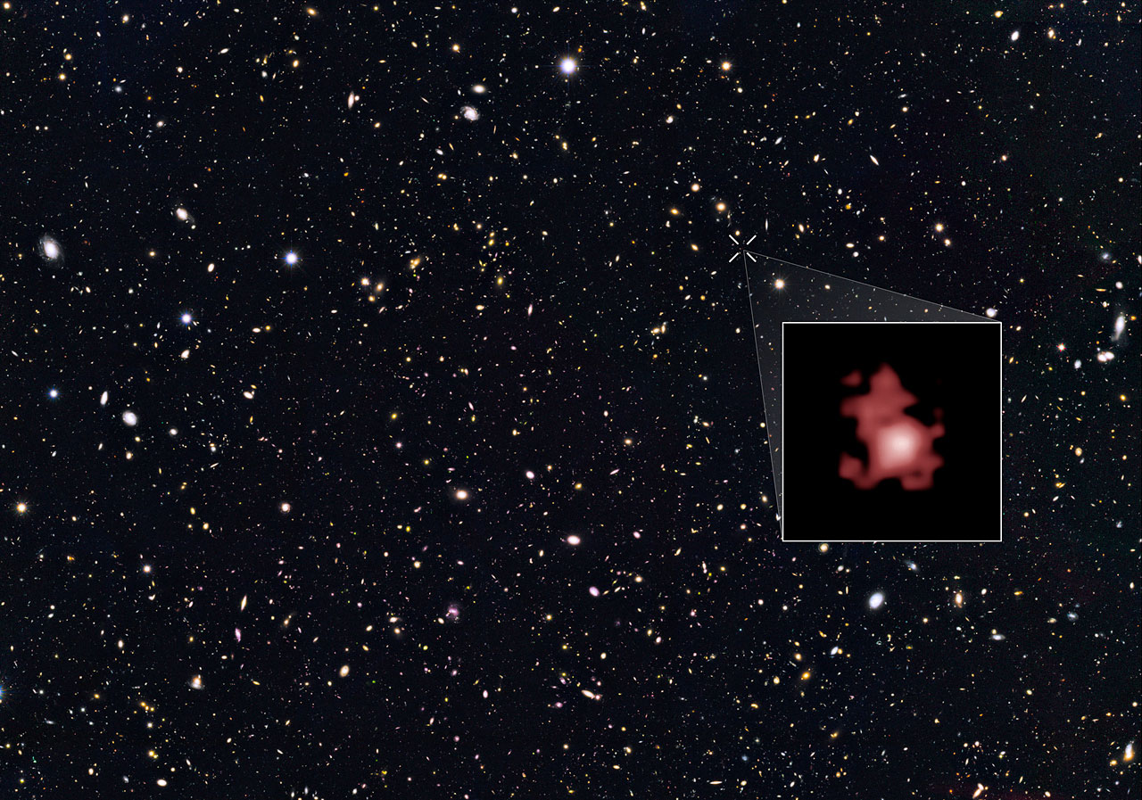 This image shows the position of the most distant galaxy discovered so far within a deep sky Hubble Space Telescope survey called GOODS North (Great Observatories Origins Deep Survey North). The survey field contains tens of thousands of galaxies stretching far back into time. The remote galaxy GN-z11, shown in the inset, existed only 400 million years after the Big Bang, when the Universe was only 3 percent of its current age. It belongs to the first generation of galaxies in the Universe and its discovery provides new insights into the very early Universe. This is the first time that the distance of an object so far away has been measured from its spectrum, which makes the measurement extremely reliable. GN-z11 is actually ablaze with bright, young, blue stars but these look red in this image because its light was stretched to longer, redder, wavelengths by the expansion of the Universe. - Image Credit: NASA, ESA, and P. Oesch (Yale University)