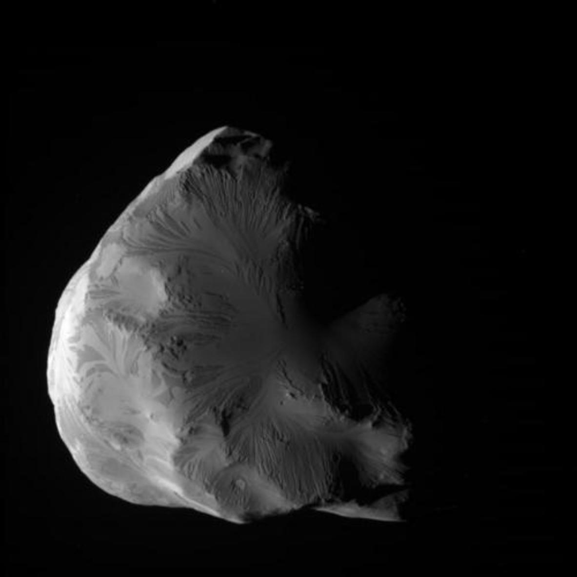 The tiny moon Helene, just 43km across. Is this a chunk of debris from a violent collision 100m years ago? -Image Credit: NASA/JPL-Caltech/Space Science Institute