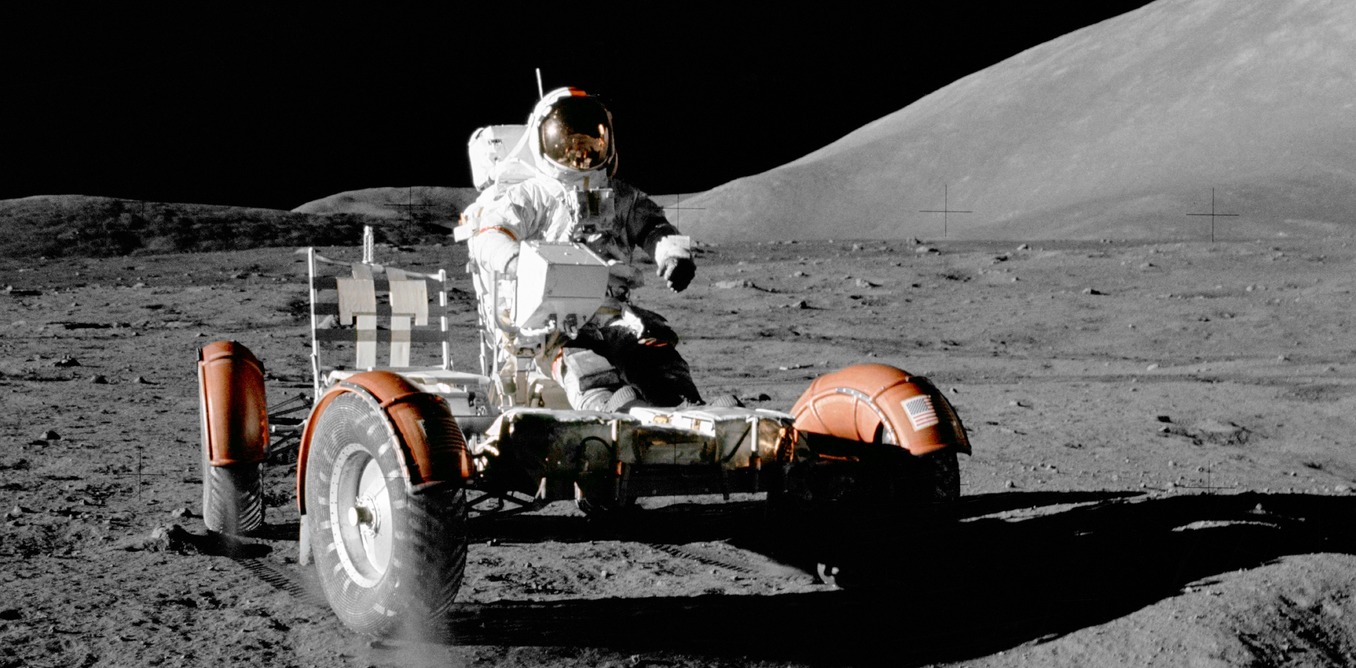 Gene Cernan driving a lunar rover in December 1972. - Image Credit: NASA