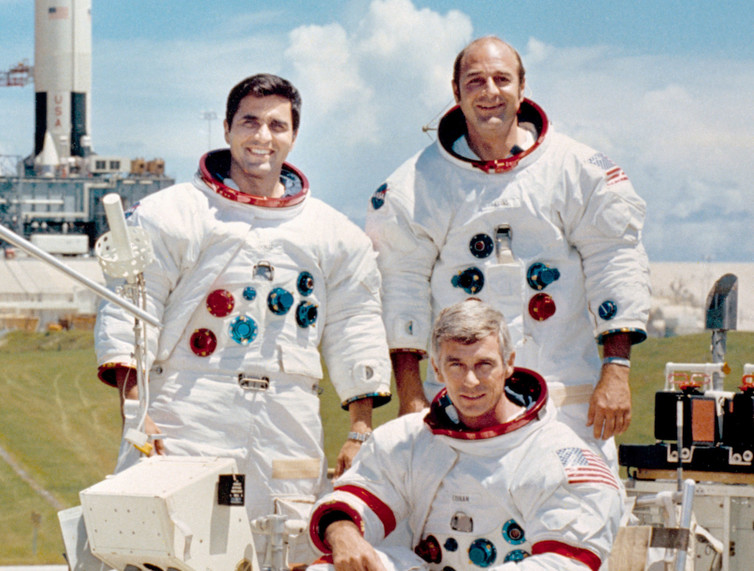 Apollo 17 crew, with commander Cernan seated. - Image Credit: NASA