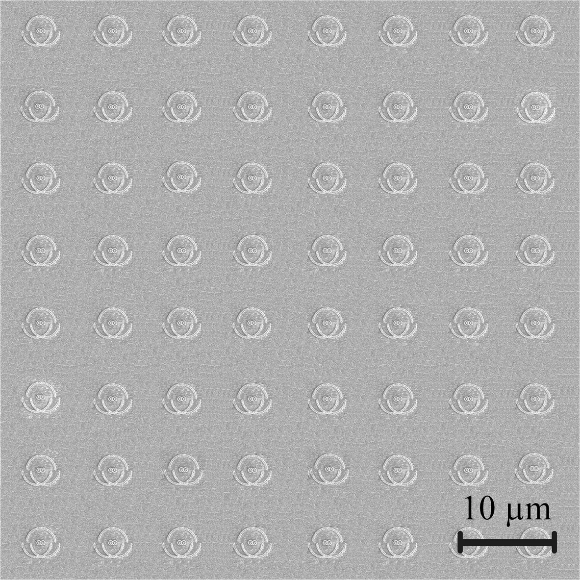 The nanophotonic chip magnified 2,000 times. Each indentation on the image is a single unit of the chip, like a single pixel in a display panel, made up of semi-circle nano-grooves and nano-apertures engraved in a metallic film. RMIT University, Author provided
