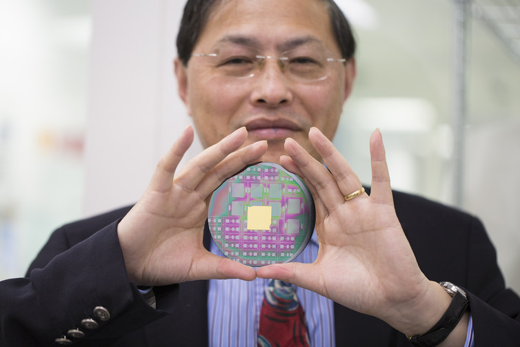 Professor Min Gu with the nanophotonic chip that can harness the angular momentum of light. RMIT University, Author provided