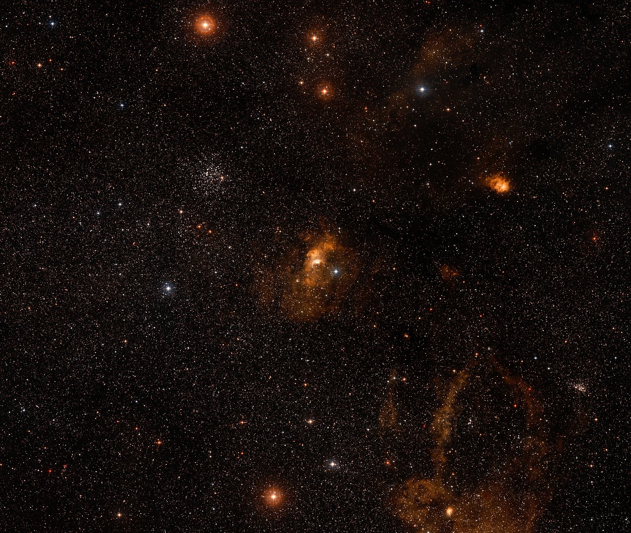 This ground-based image shows the Bubble Nebula and its surroundings, including the interstellar cloud which is illuminated by stellar winds from the central star within the Bubble Nebula. – Image Credit: NASA, ESA, Digitized Sky Survey 2 Acknowledgement: Davide De Martin