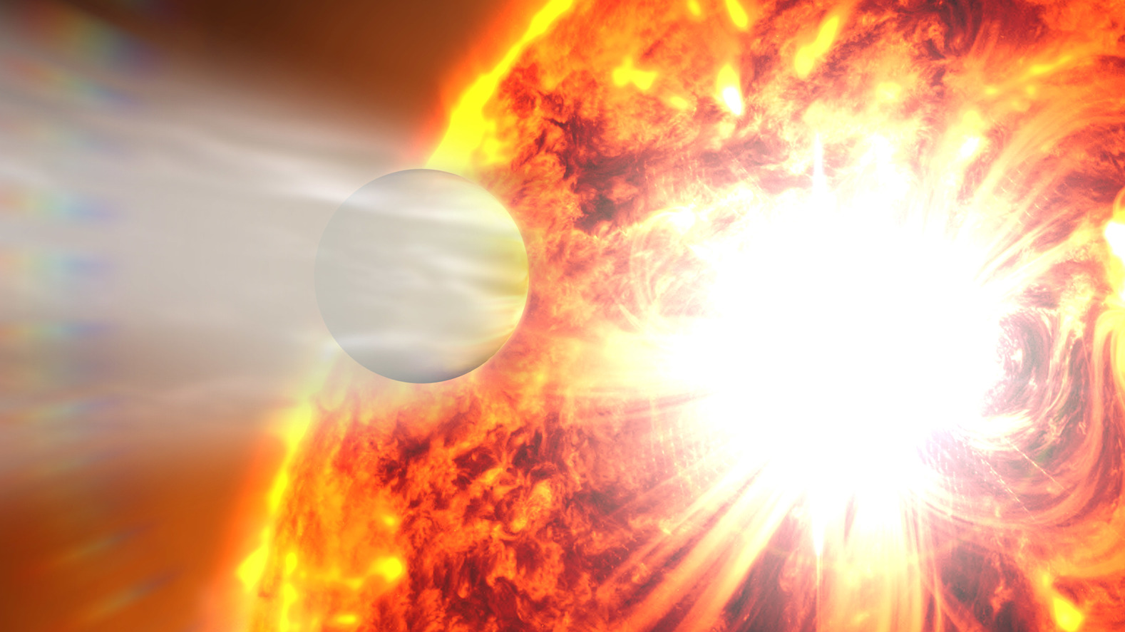 Artists impression of HD 189733 b, a Hot Jupiter so close to its host that its atmosphere is being boiled off into space. - Image Credit: NASA's Goddard Space Flight Center
