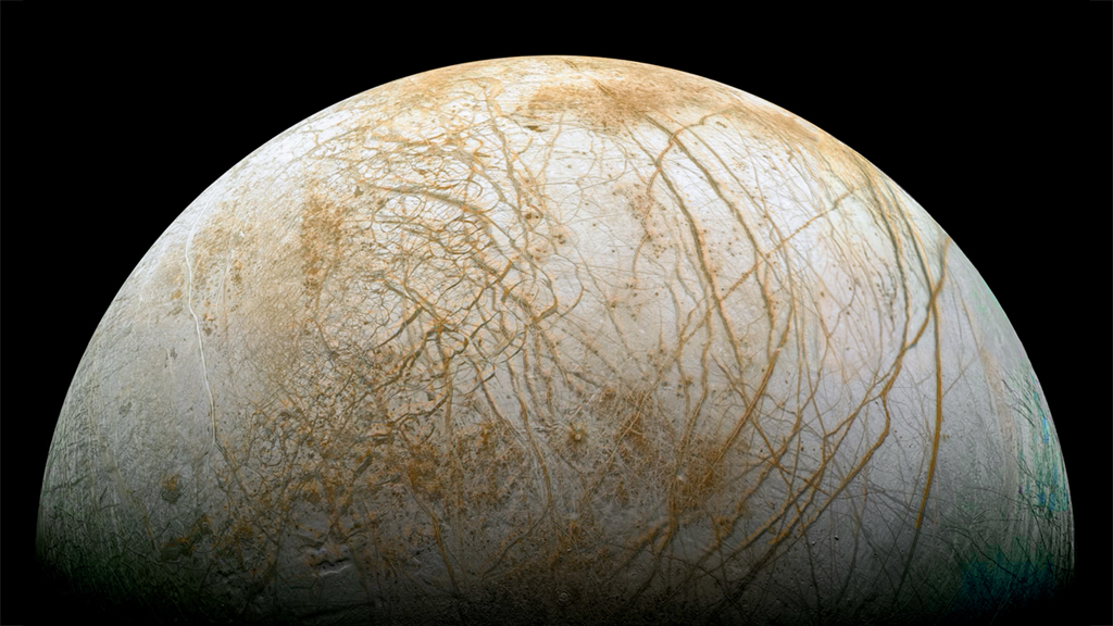 The prize, Europa, a watery world. - Image Credit: NASA