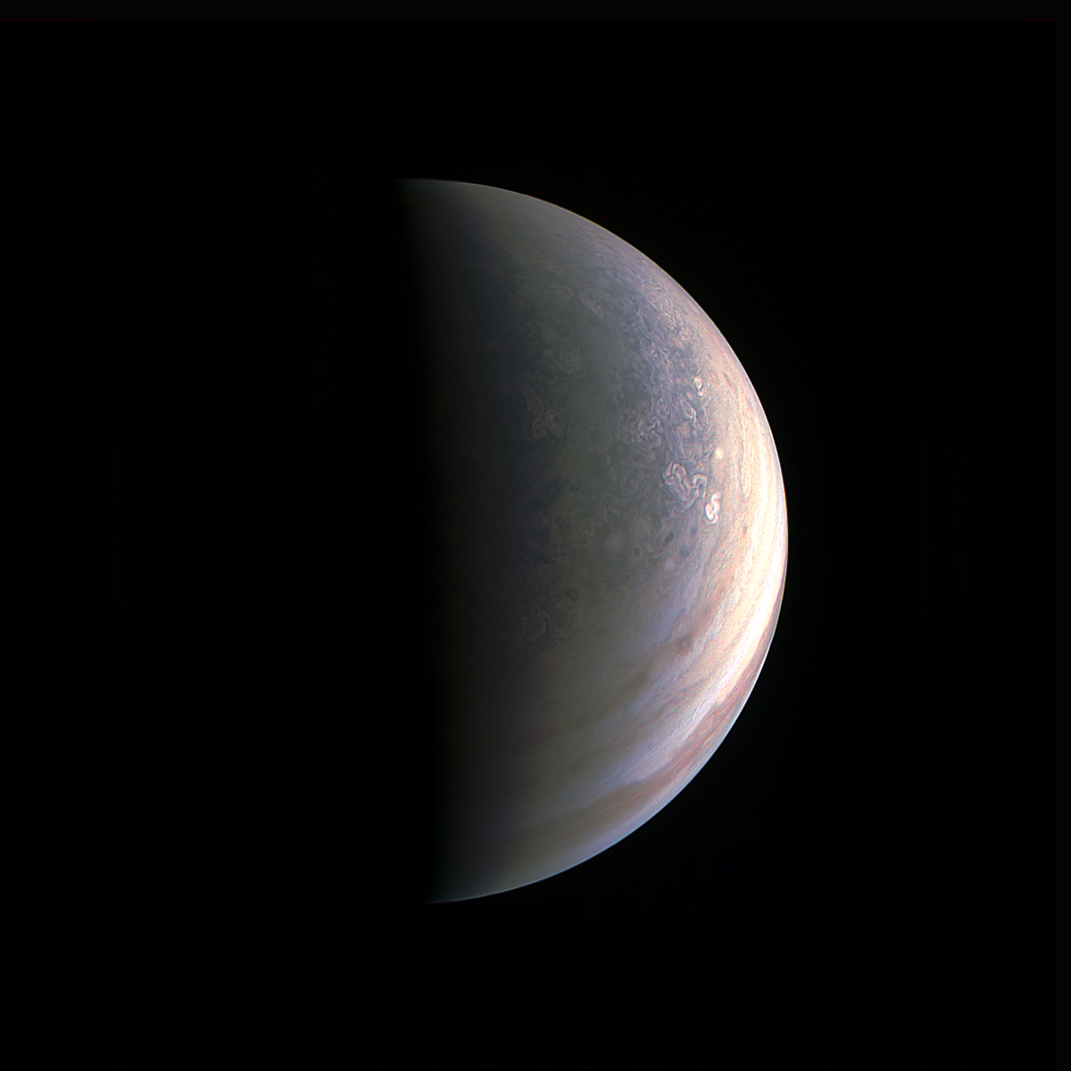 NASA's Juno spacecraft captured this view as it closed in on Jupiter's north pole, about two hours before closest approach on Aug. 27, 2016. - Image Credits: NASA/JPL-Caltech/SwRI/MSSS