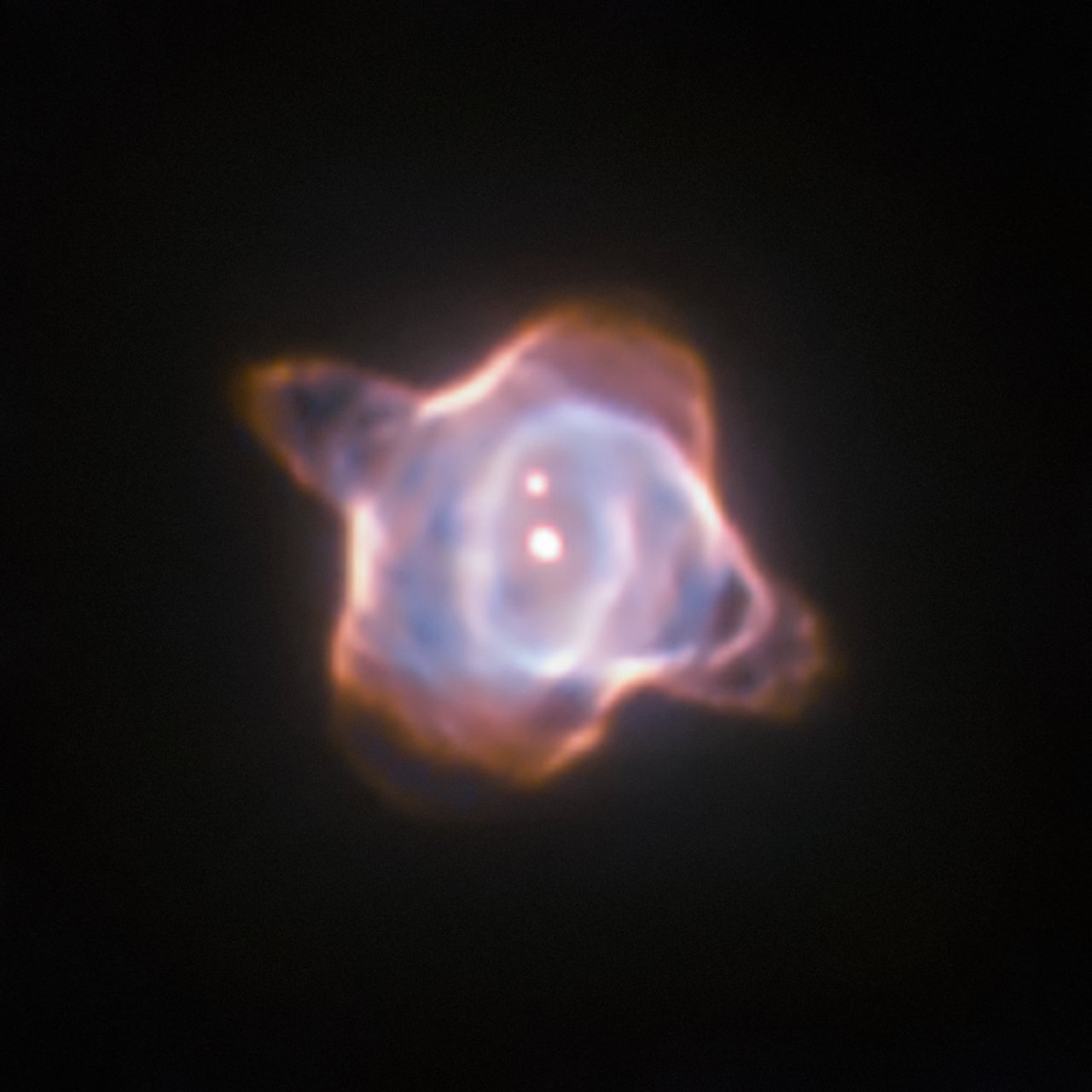 This image of the Stingray nebula, a planetary nebula 2700 light-years from Earth, was taken with the Wide Field and Planetary Camera 2 (WFPC2) in 1998. In the centre of the nebula the fast evolving star SAO 244567 is located. Observations made within the last 45 years showed that the surface temperature of the star increased by almost 40 000 degree Celsius. Now new observations of the spectra of the star have revealed that SAO 244567 has started to cool again. - Image Credit: ESA/Hubble & NASA