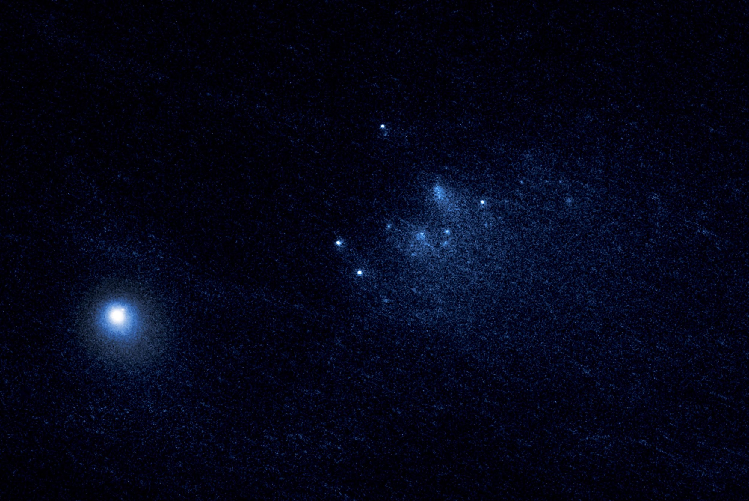 This NASA Hubble Space Telescope image reveals the ancient Comet 332P/Ikeya-Murakami disintegrating as it approaches the sun. The comet debris consists of a cluster of building-size chunks (center) that form a 3,000-mile-long trail. The fragments are drifting away from the comet. The main nucleus of Comet 332P is the bright object at lower left. This observation was made on Jan. 27, 2016, with Hubble's Wide Field Camera.- Image Credits: NASA, ESA, D. Jewitt (UCLA)