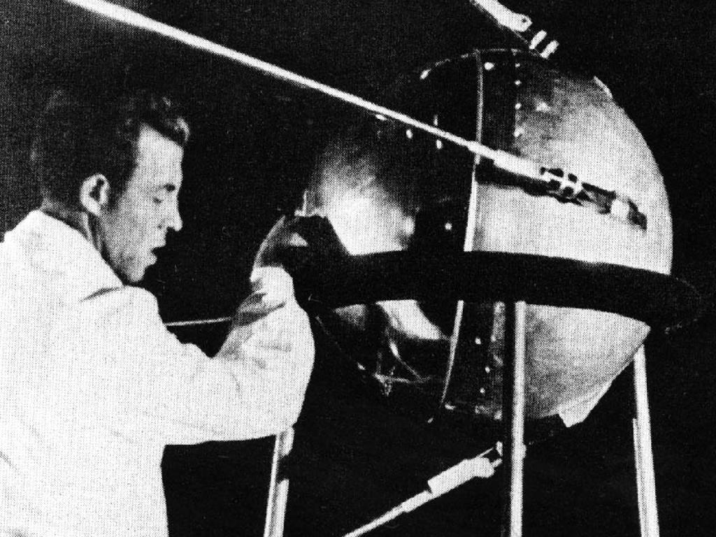 Photograph of a Russian technician putting the finishing touches on Sputnik 1, humanity’s first artificial satellite. - Image Credit: NASA/Asif A.