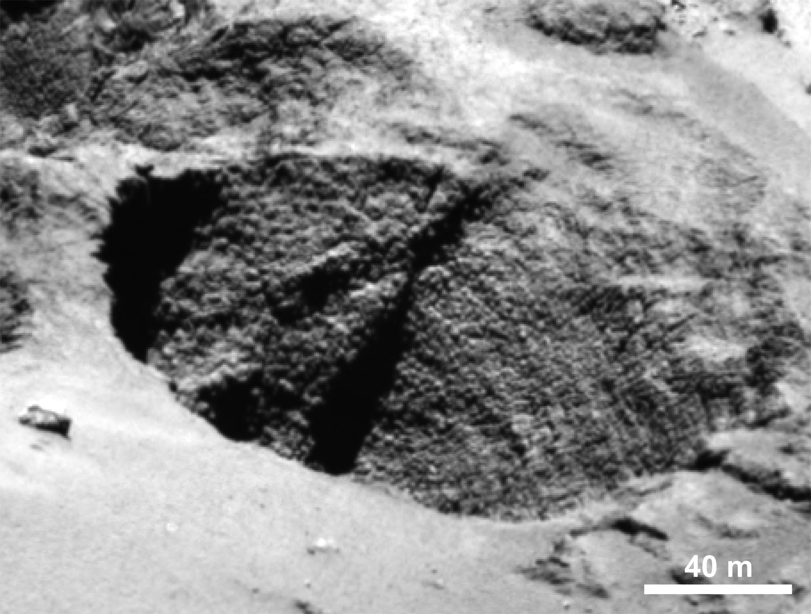 Close-up of a curious surface texture nicknamed ‘goosebumps’. The bumps are about 9 feet (3 meters) across and seen on very steep slopes and exposed cliff faces. They may represent the original balls of icy dust that glommed together to form comets 4.5 billion years ago. Credit: ESA/Rosetta/MPS for OSIRIS Team MPS/UPD/LAM/IAA/SSO/INTA/UPM/DASP/IDA