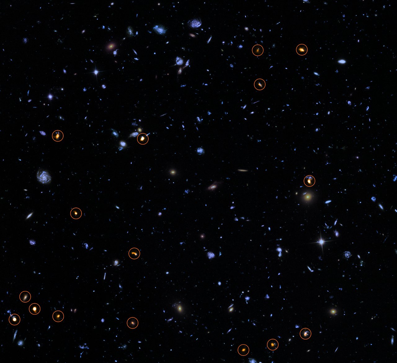 This image combines a background picture taken by the NASA/ESA Hubble Space Telescope (blue/green) with a new very deep ALMA view of this field (orange, marked with circles). All the objects that ALMA sees appear to be massive star-forming galaxies . - Image Credit: ALMA (ESO/NAOJ/NRAO)/NASA/ESA/J. Dunlop et al. and S. Beckwith ( STScI ) and the HUDF Team.