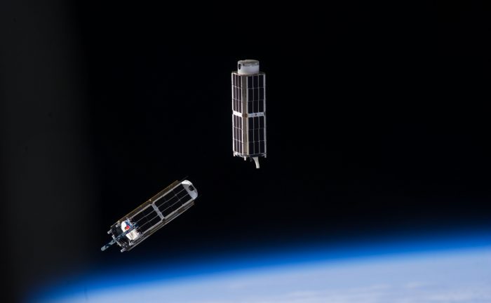 NanoRacks CubeSats photographed after deployment from the ISS by an Expedition 38 crew member. - Image Credit: NASA