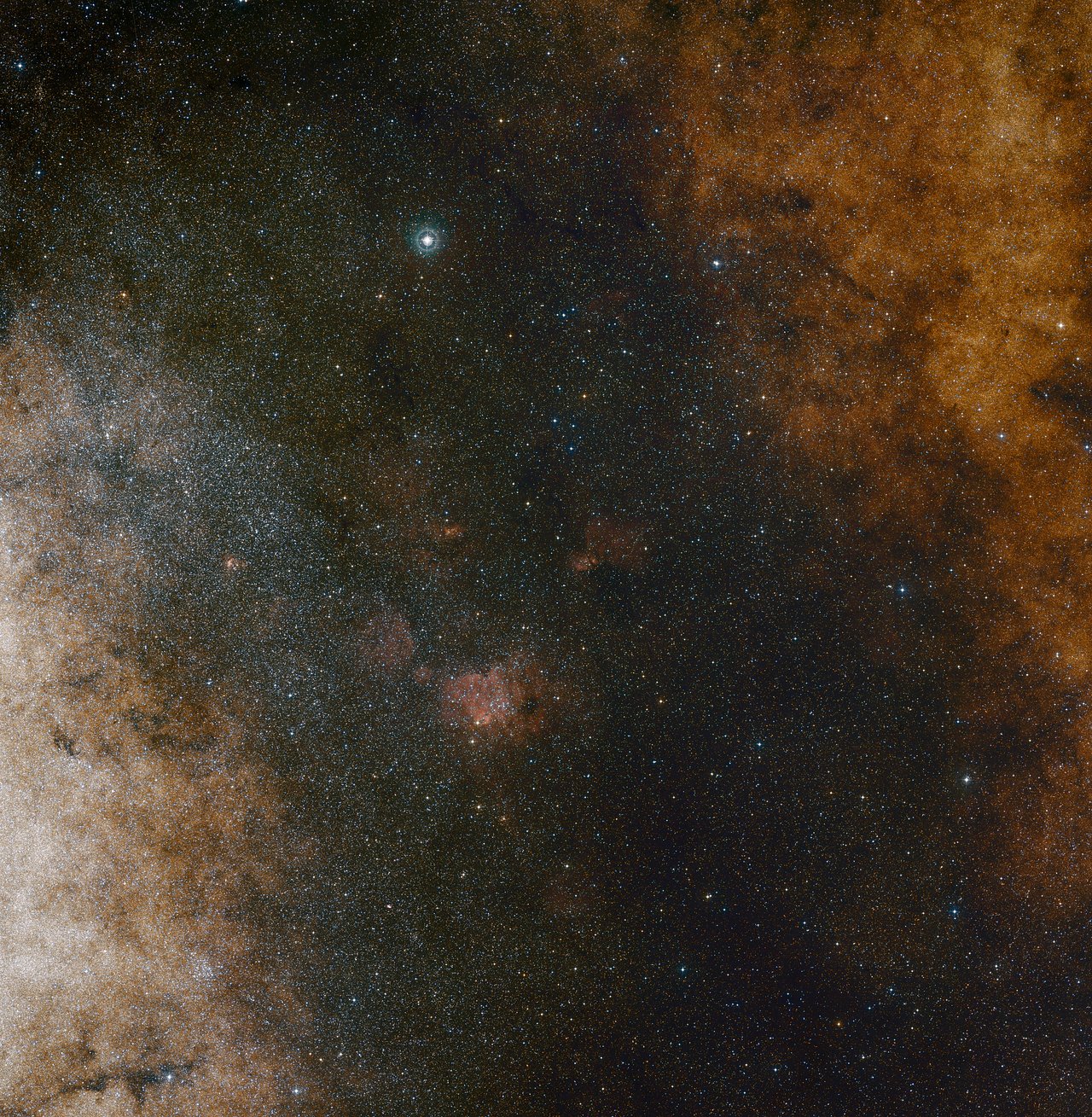 This visible light wide-field view shows the rich star clouds in the constellation of Sagittarius (the Archer) in the direction of the centre of our Milky Way galaxy. The entire image is filled with vast numbers of stars — but far more remain hidden behind clouds of dust and are only revealed in infrared images. This view was created from photographs in red and blue light and forming part of the Digitized Sky Survey 2. The field of view is approximately 3.5 degrees x 3.6 degrees. – Image Credit : ESO and Digitized Sky Survey 2. Acknowledgment: Davide De Martin and S. Guisard