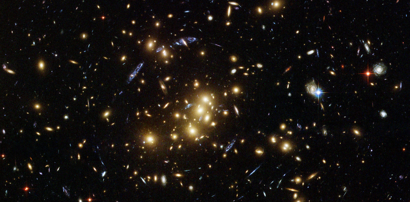 Rich galaxy cluster imaged by Hubble. – Image Credit: NASA, ESA, M.J. Jee and H. Ford (Johns Hopkins University)