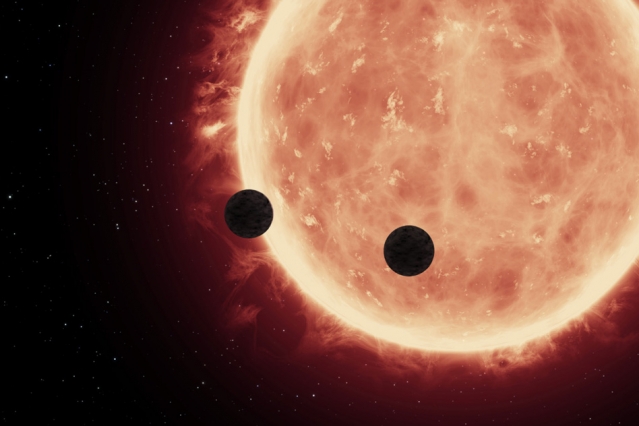 An artist’s depiction of planets transiting a red dwarf star in the TRAPPIST-1 System. – Image Credit: NASA/ESA/STScl