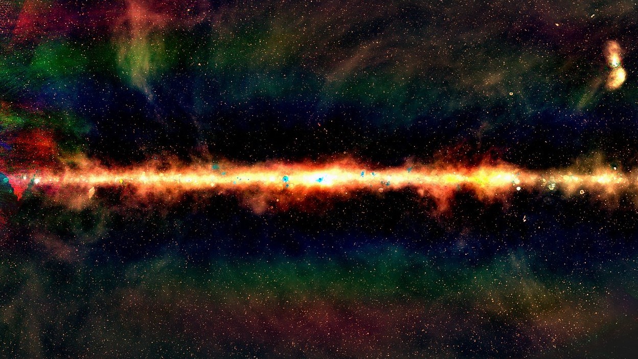 The GLEAM view of the centre of the Milky Way, in radio colour. Red indicates the lowest frequencies, green the middle frequencies and blue the highest frequencies. Each dot is a galaxy, with around 300,000 radio galaxies observed as part of the GLEAM survey. – Image Credit: Natasha Hurley-Walker (ICRAR/Curtin) and the GLEAM Team.