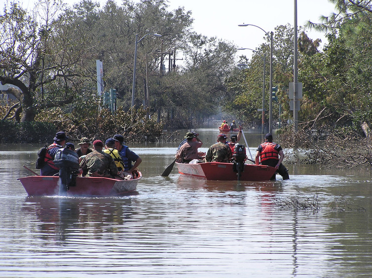 Rescue boats ferry people through flooded streets in New Orleans after Hurricane Katrina, September 11, 2005. - Image Credit: USCG/Flickr , CC BY-NC