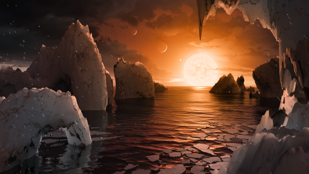 Illustration showing the possible surface of TRAPPIST-1f, one of the newly discovered planets in the TRAPPIST-1 system. - Image Credits: NASA/JPL-Caltech