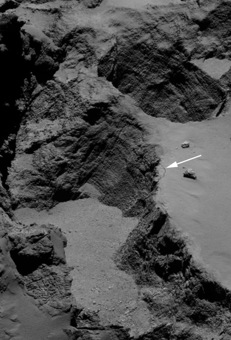 Image of the Aswan cliff taken on The white arrow shows the 70 m long, 1 m wide fracture at the edge of the cliff - Image Credit: ESA/Rosetta/MPS for OSIRIS Team MPS/UPD/LAM/IAA/SSO/INTA/UPM/DASP/IDA