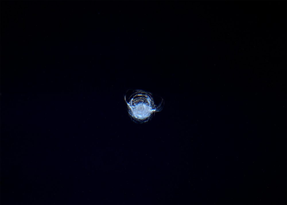 The chip in the ISS’ Cupola window, photographed by astronaut Tim Peake. - Image Credit: ESA/NASA/Tim Peake