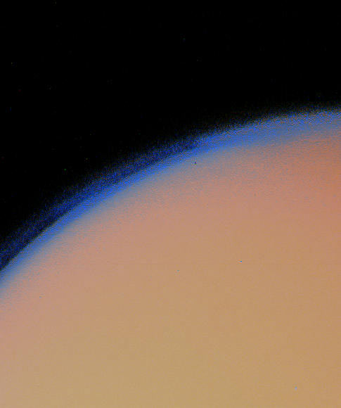 Saturn’s moon Titan lies under a thick blanket of orange haze in this Voyager 1 picture. - Image Credit: NASA