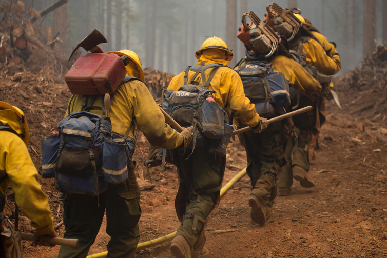 Hotshot crews head out to fight the Happy Camp Complex fire in California’s Klamath National Forest in 2014. The fire was started by lightning strikes and burned 134,000 acres. - Image Credit: Kari Greer, US Forest Service/Flickr , CC BY