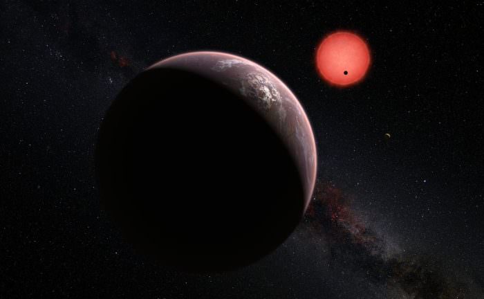 Artist's impression of of the exoplanets orbiting the ultracool dwarf star TRAPPIST-1. - Image Credit: ESO/M. Kornmesser/N. Risinger (skysurvey.org).