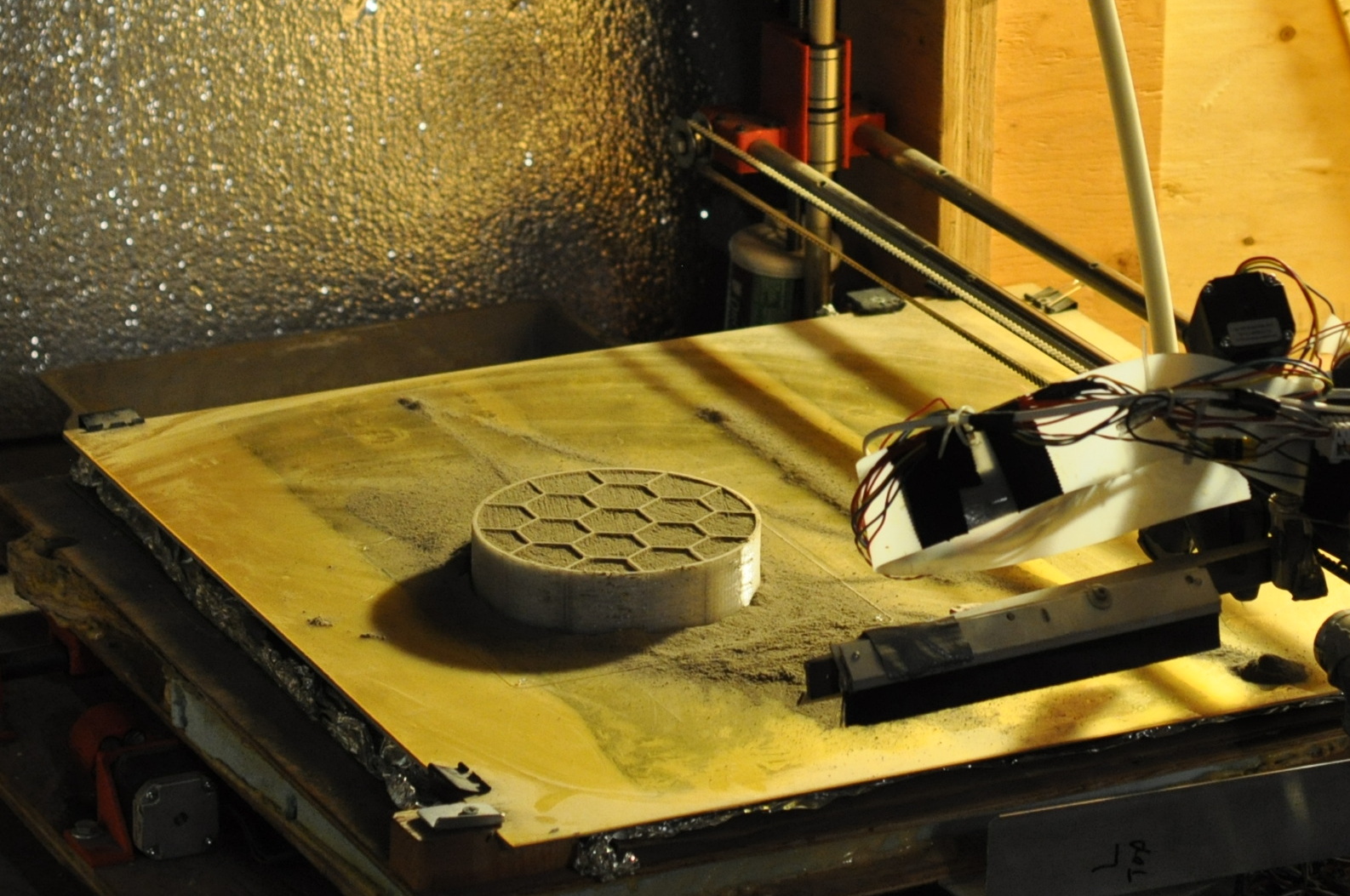 A 3D printer created by the University of Alaska team prints a cone for their entry in the Level 2, Phase 1 Compression Test Competition of NASA’s 3D-Printed Habitat Competition. The university was awarded $14,070 for this stage of the challenge. - Image Credits: Courtesy of University of Alaska