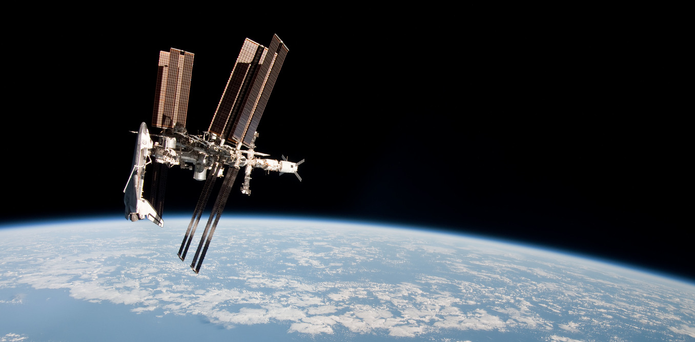 ISS and Endeavour seen from the Soyuz TMA spacecraft. - Image Credit: NASA