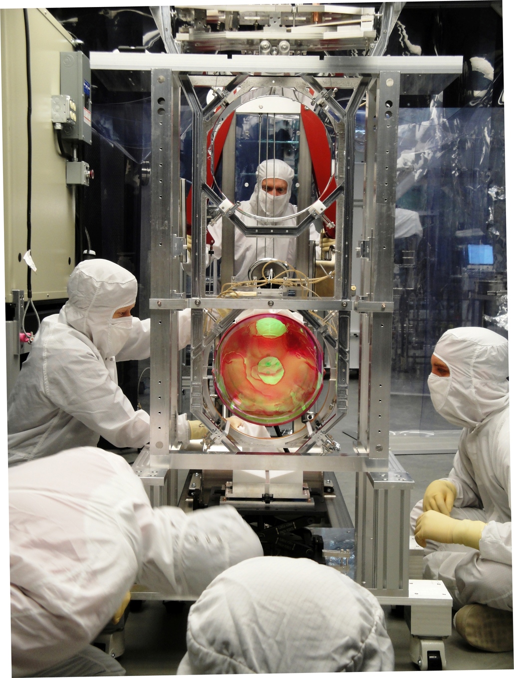 LIGO scientists working on its optics suspension. - Image Credit: LIGO Laboratory, CC BY-ND