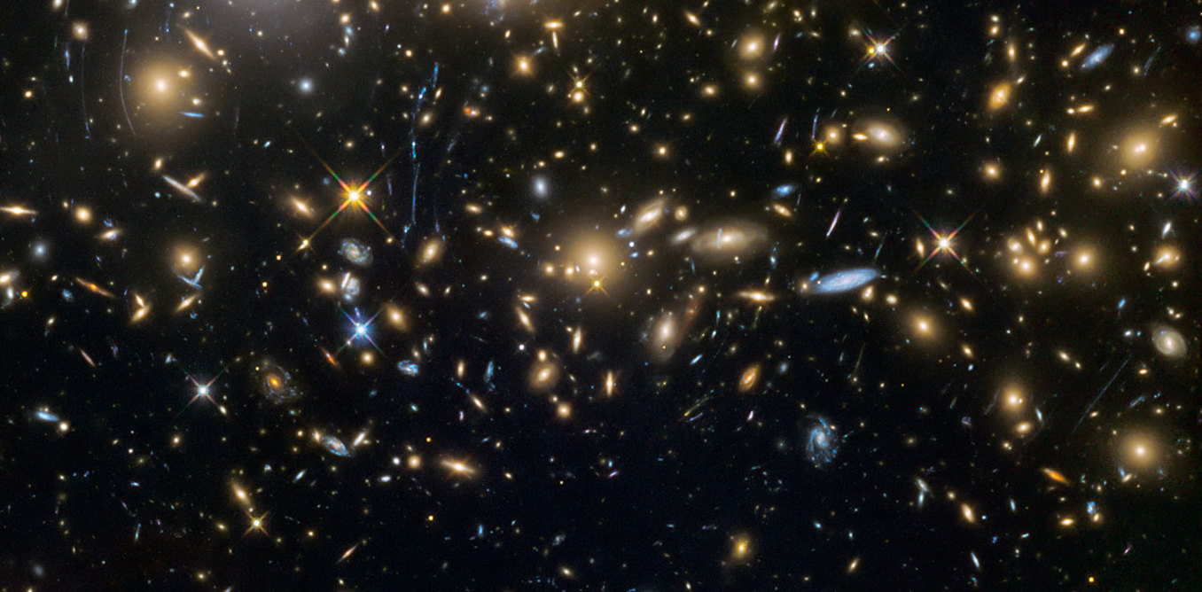 Some of the earliest known galaxies in the universe, seen by the Hubble Space Telescope. - Image Credit: NASA/ESA