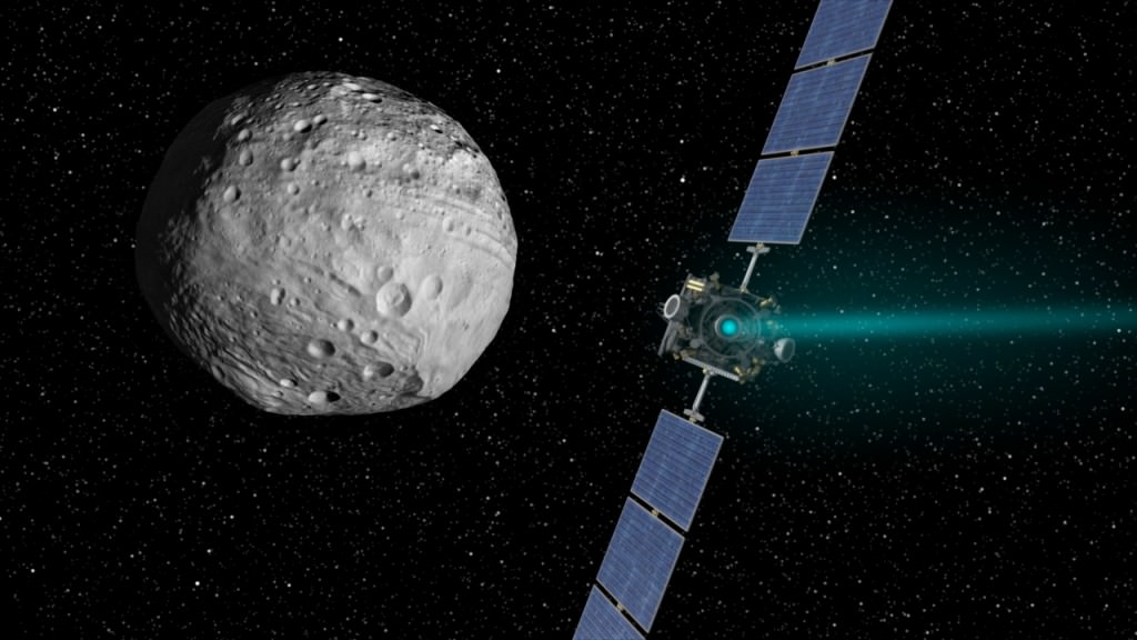Artist's concept of the Dawn spacecraft arriving at Vesta. - Image credit: NASA/JPL-Caltech