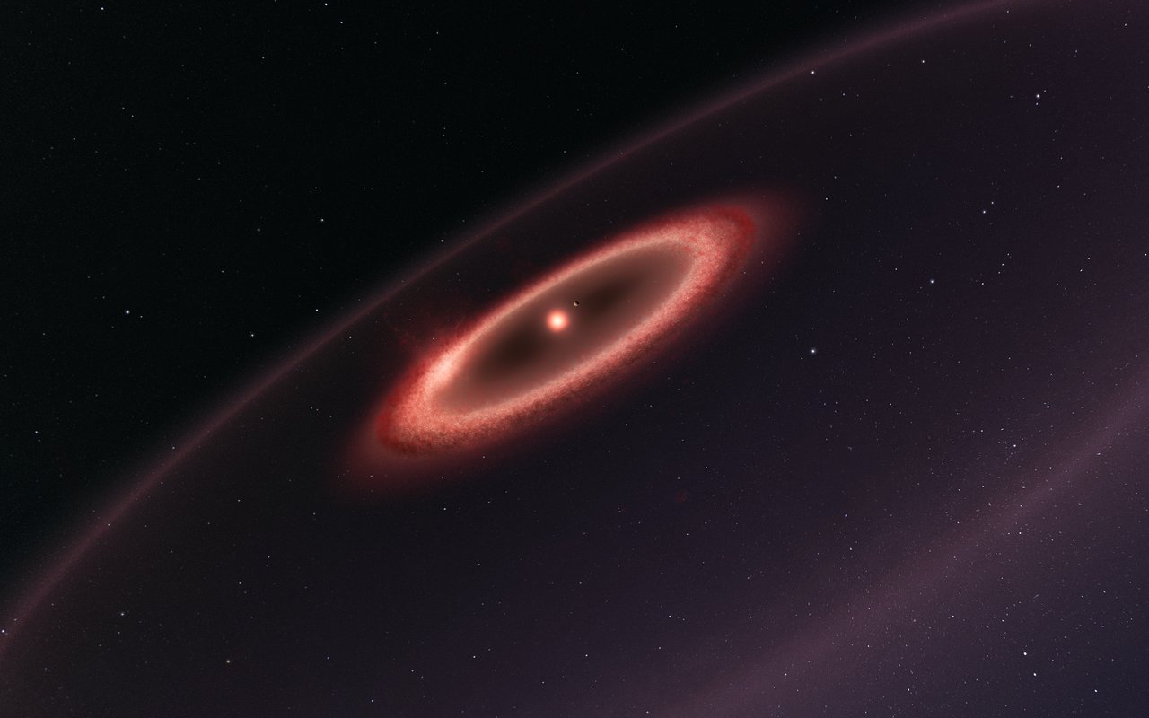 This artist’s impression shows how the newly discovered belts of dust around the closest star to the Solar System, Proxima Centauri, may look. ALMA observations revealed the glow coming from cold dust in a region between one to four times as far from Proxima Centauri as the Earth is from the Sun. The data also hint at the presence of an even cooler outer dust belt and indicate the presence of an elaborate planetary system. These structures are similar to the much larger belts in the Solar System and are also expected to be made from particles of rock and ice that failed to form planets. - Note that this sketch is not to scale — to make Proxima b clearly visible it has been shown further from the star and larger than it is in reality. - Image Credit : ESO/M. Kornmesser