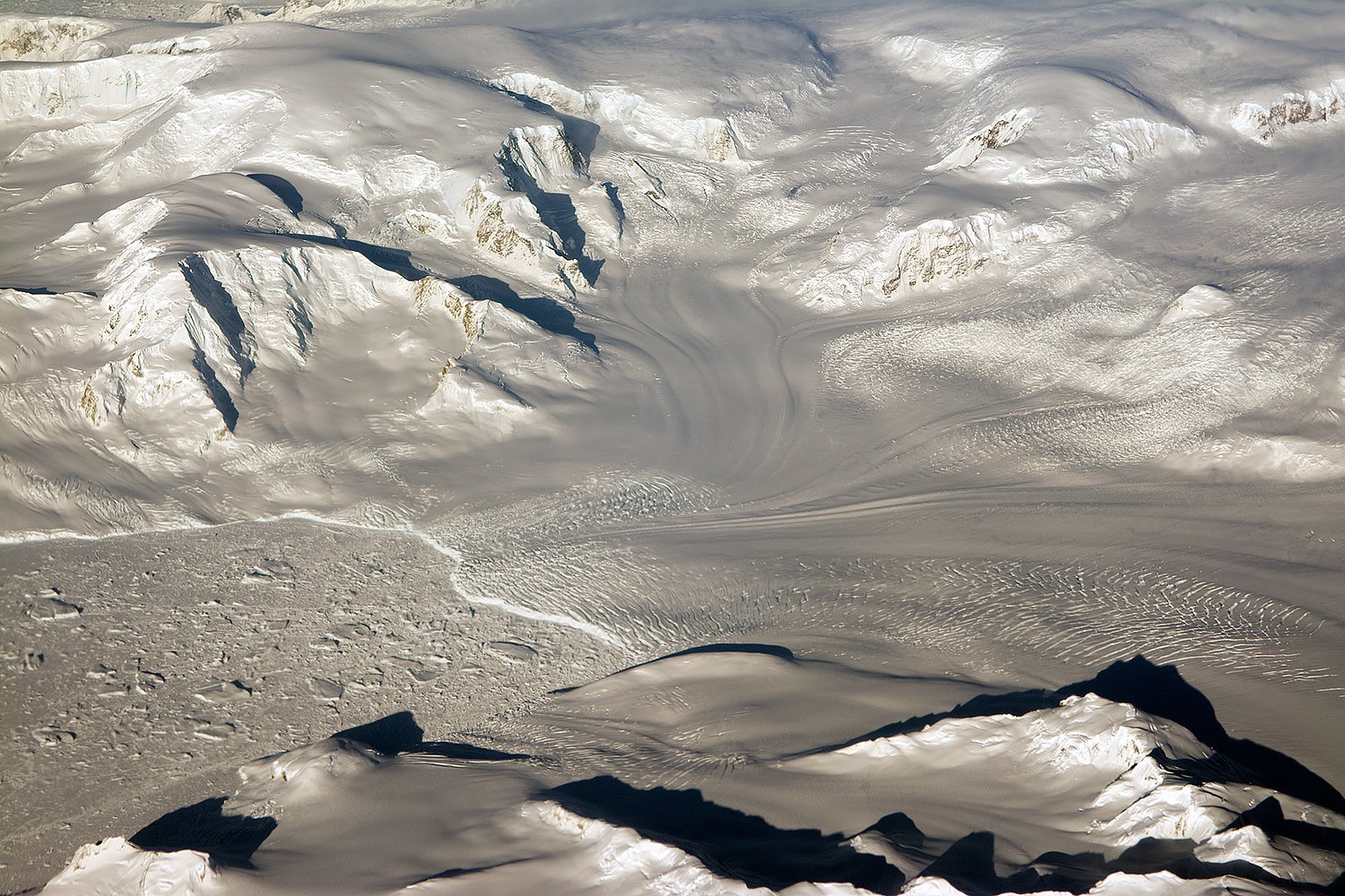 Glaciers seen during NASA’s Operation IceBridge research flight to West Antarctica on Oct. 29, 2014. - Image Credit: NASA/Michael Studinger