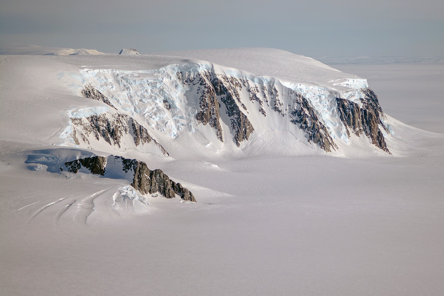 A view of mountains and glaciers in Antarctica’s Marie Byrd Land seen during the Nov. 2nd, 2014, IceBridge survey flight. - Image Credit: NASA / Michael Studinger