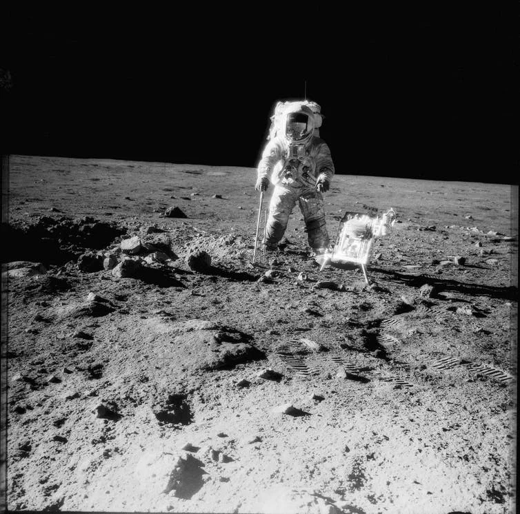 Apollo 12 crewman with tools and carrier of Apollo Lunar Hand Tools on the Moon, November 1969. - Image Credit: NASA