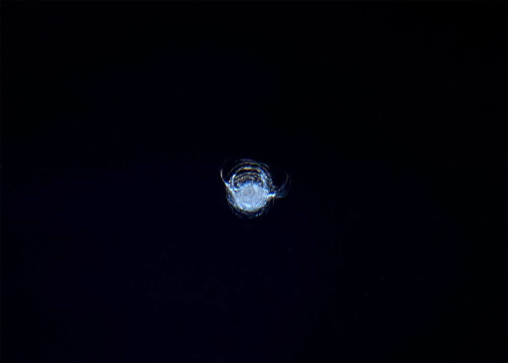 The chip in the ISS’ Cupola window, photographed by astronaut Tim Peake. - Image Credit: ESA/NASA/Tim Peake