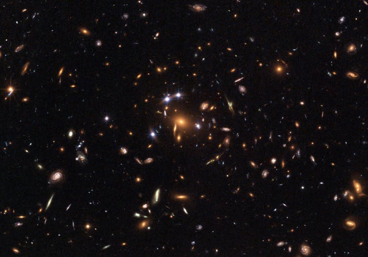 Galaxy cluster SDSS – what’s pushing it apart at an accelerated rate? - Image Credit: ESA, NASA, K. Sharon (Tel Aviv University) and E. Ofek (Caltech).