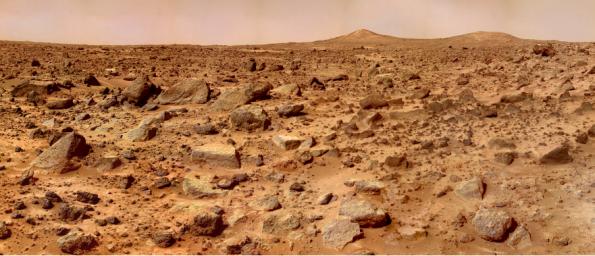 The rocks that scatter on this dusty terrain could be behind the disappearance of water on Mars. - Image Credit: NASA