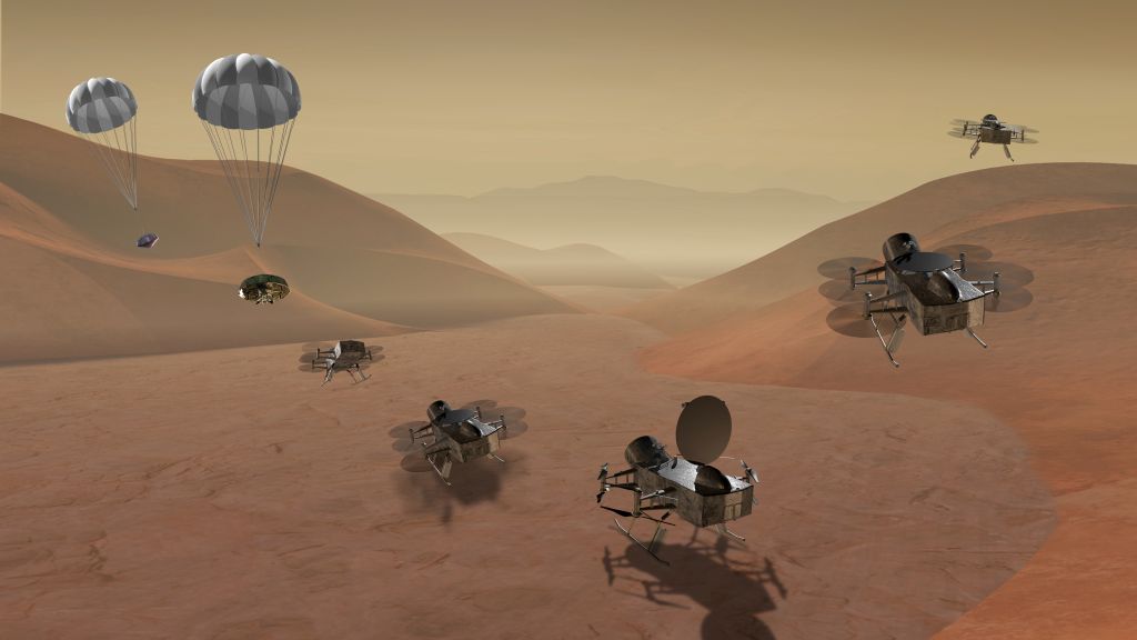 In this illustration, the Dragonfly helicopter drone is descending to the surface of Titan. - Image Credit: NASA