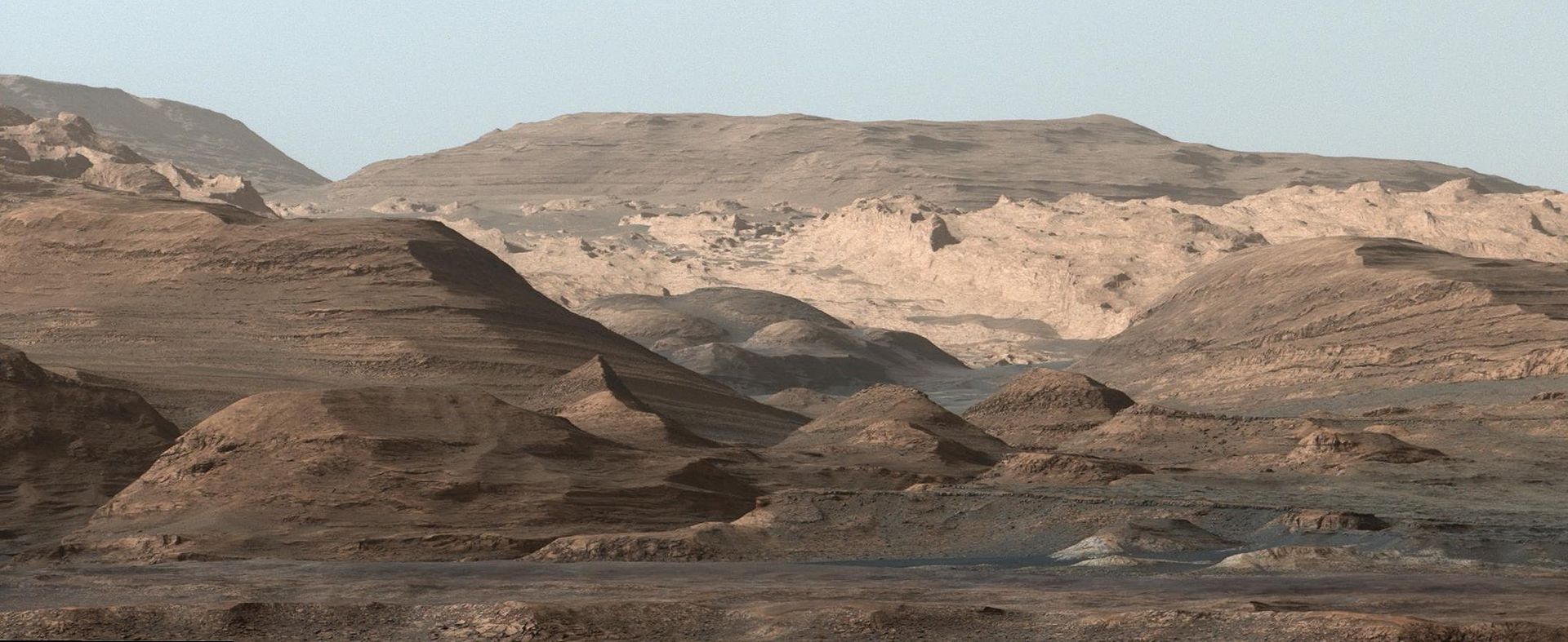 Image of Mount Sharp taken by the Curiosity rover on Aug. 23rd, 2012. The layers at the base of Mt. Sharp show the geological history of Mars. - Image Credit: NASA/JPL-Caltech/MSSS.
