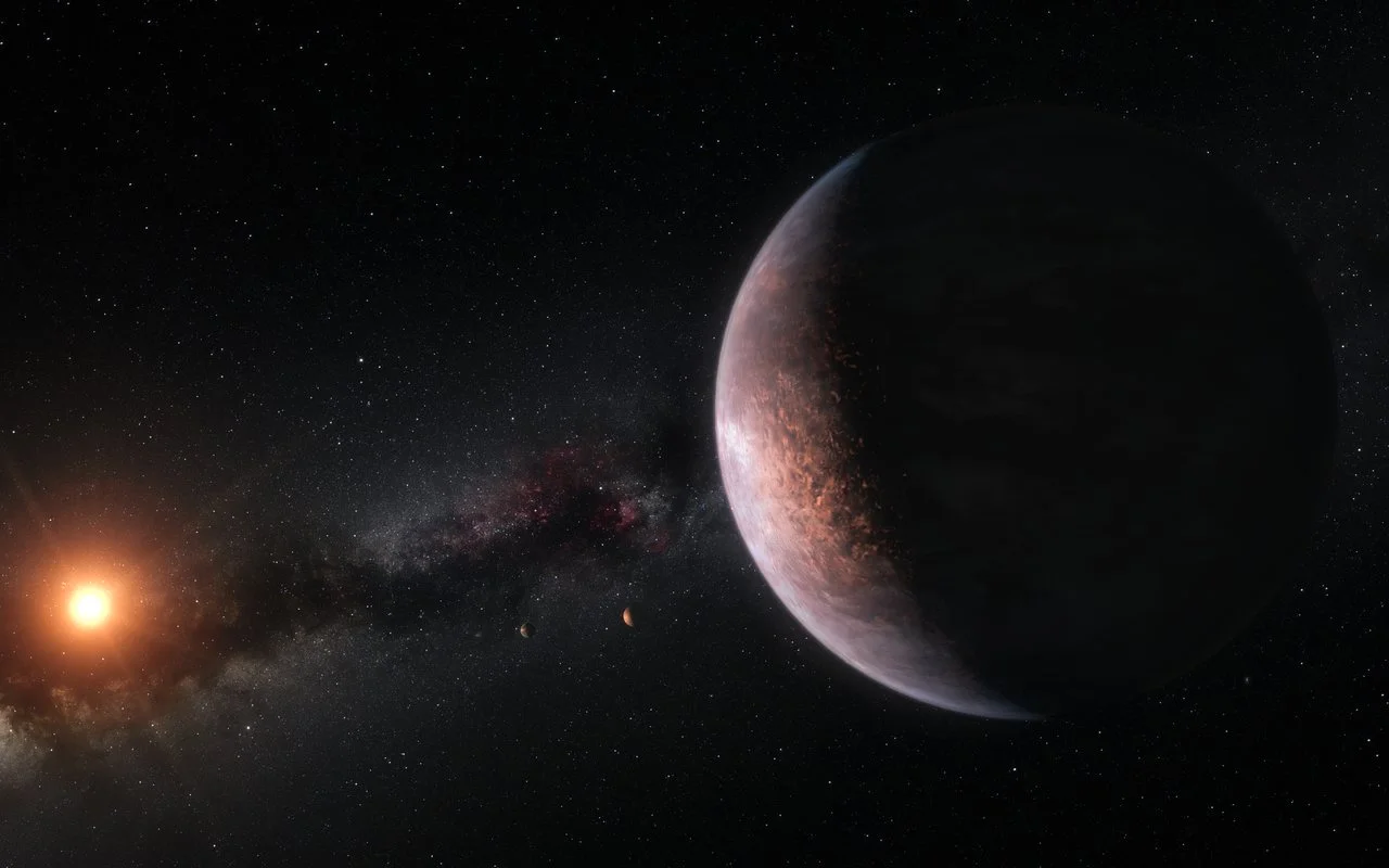 This artist’s impression shows several of the planets orbiting the ultra-cool red dwarf star TRAPPIST-1. - Image Credit: ESO/M. Kornmesser