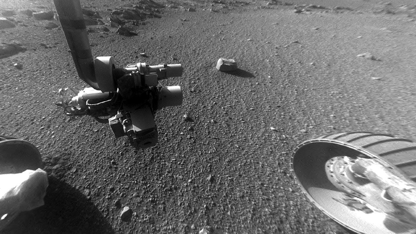 This late-afternoon view from the front Hazard Avoidance Camera on NASA's Mars Exploration Rover Opportunity shows a pattern of rock stripes on the ground, a surprise to scientists on the rover team. It was taken in January 2018, as the rover neared Sol 5000 of what was planned as a 90-sol mission. - Image Credit: NASA/JPL-Caltech