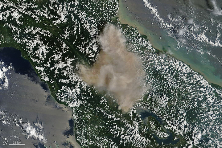 The Eruption of Sinabung Volcano, Indonesia, as seen from space. - Image Credit: NASA Earth Observatory.