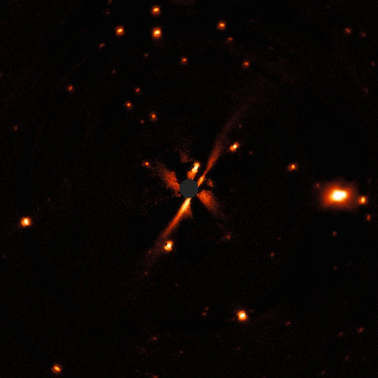 The disc extends from the lower-left to the upper-right and the central grey region shows where the star was masked out. - Image Credit : ESO/E. Sissa et al.