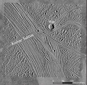 A higher-resolution Galileo image of Ganymede overlayed on a grainier Voyager image. The strike fault Kishar Sulcus is labelled. It intersects another feature called Tiamat Sulcus, running across Kishar Sulcus. - Image Credit: NASA, Cameron et al. 2018