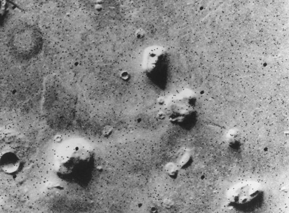 NASA’s Viking 1 Orbiter spacecraft photographed this region in the northern latitudes of Mars on July 25, 1976 while searching for a landing site for the Viking 2 Lander. The eroded rock resembles a human face near the centre of the image - Image Credit: NASA/JPL