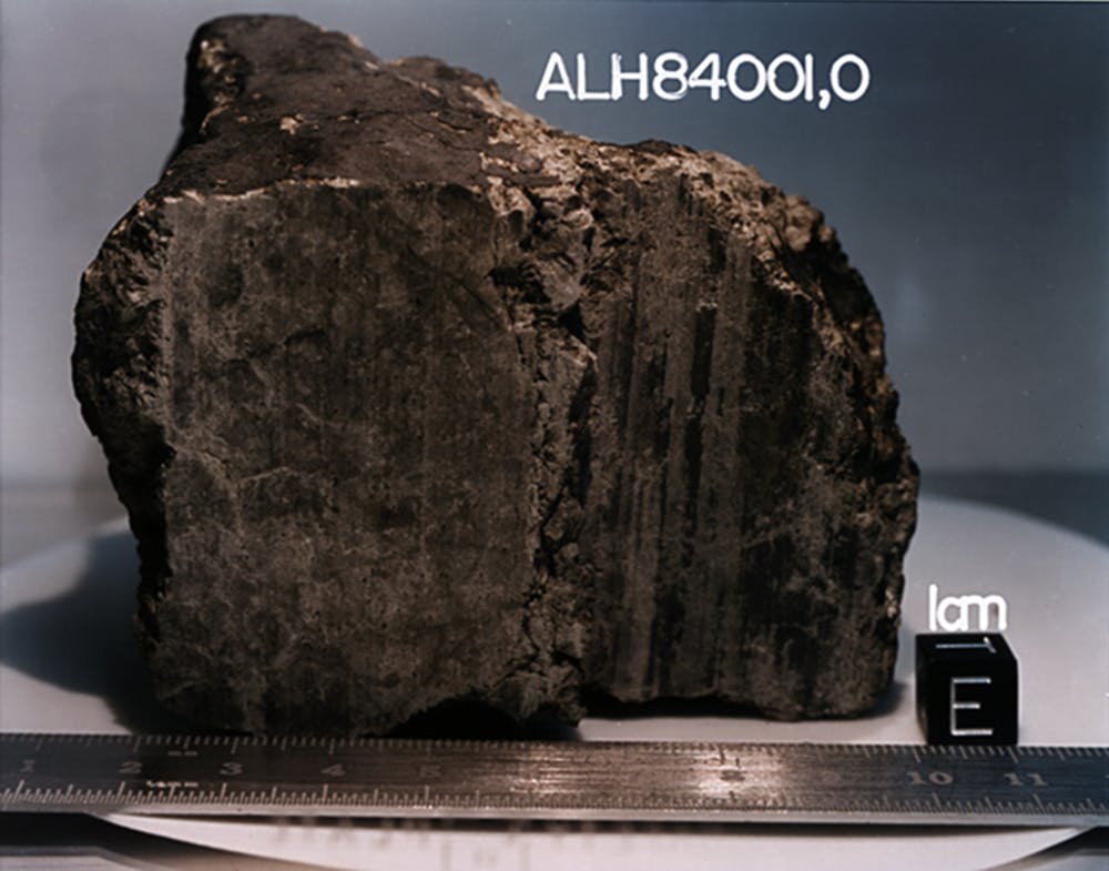 A 4.5 billion-year-old rock, labeled meteorite ALH84001, identified from Mars. - Image Credit: NASA/JSC/Stanford University
