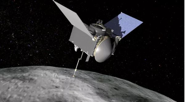 This artist’s concept shows the OSIRIS-REx spacecraft approaching the asteroid Bennu. - Image Credit: NASA