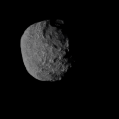 A Voyager2 image of Proteus. It’s not a great image, because Voyager2’s cameras were designed for more brightly-lit objects, but a large crater is visible on the upper right, partly in shadow. - Image Credit: NASA/Voyager2.